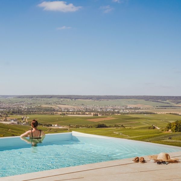 Outdoor pool at the Spa Royal Champagne in Champillon, 45 minutes from Paris and 15 minutes from Reims, overlooking the Marne Valley.